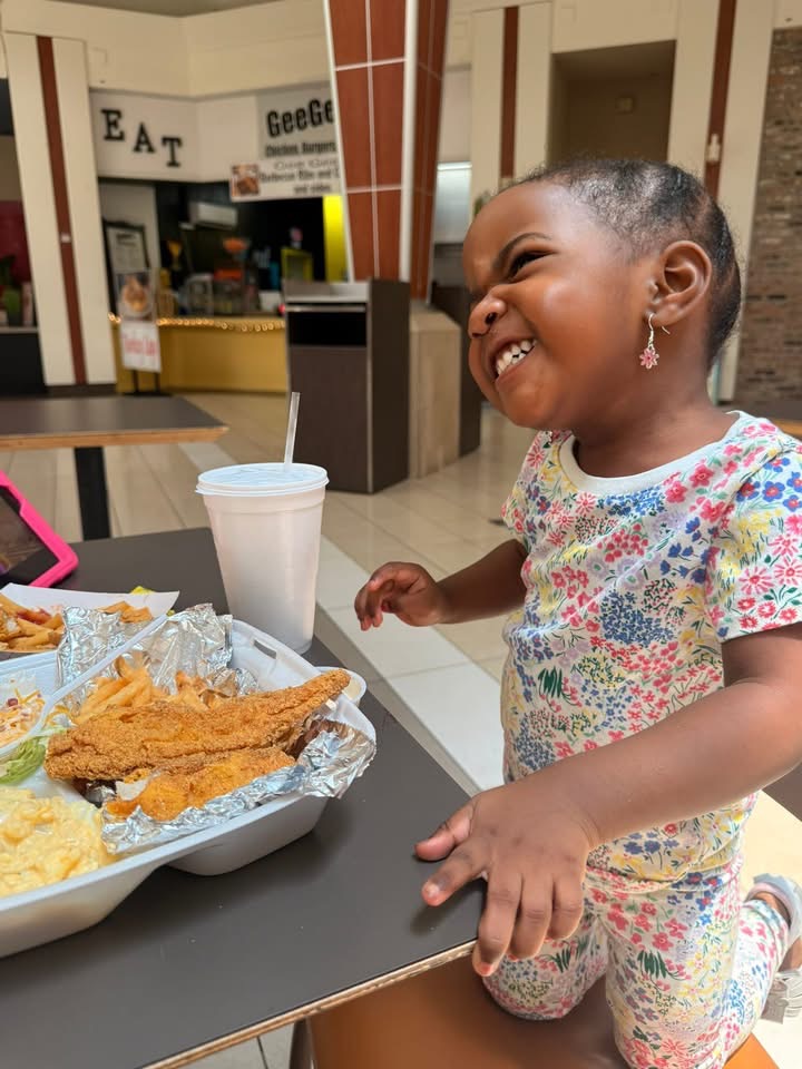 Happy customer with fried catfish plate